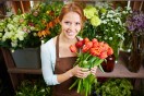 pretty florist holding a bunch of tulips