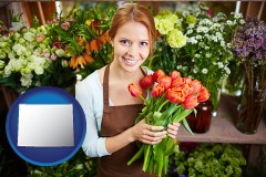 wyoming map icon and pretty florist holding a bunch of tulips