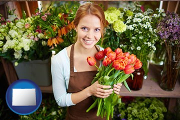 pretty florist holding a bunch of tulips - with Colorado icon