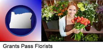 pretty florist holding a bunch of tulips in Grants Pass, OR